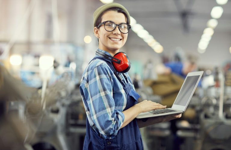 Confident maintenance engineer at industrial factory
