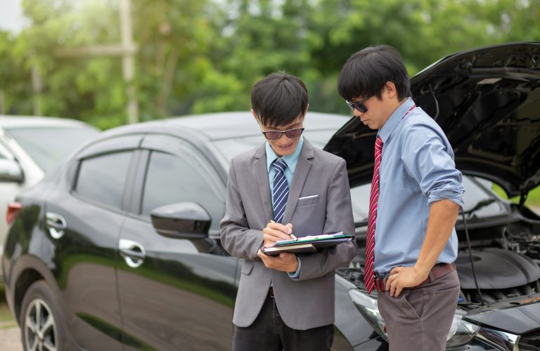 Insurance agent come to check the event to make a claim. Car insurance.